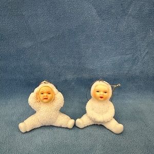 Set of 2 vintage porcelain snow babies ornaments.
